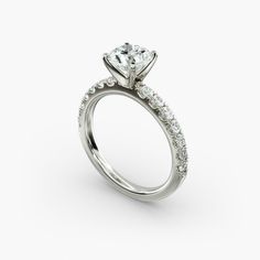 a diamond engagement ring on a white background