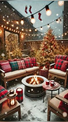 an outdoor patio decorated for christmas with plaid furniture and stockings hanging from the ceiling, lit by warm lights