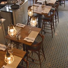 an empty restaurant with many tables and chairs