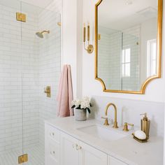 the instagram page shows an image of a white bathroom with gold accents