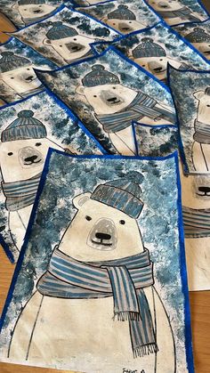 several polar bears are shown with blue and white scarfs on their heads, while one bear is wearing a knitted hat