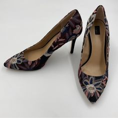 - G.I.L.I. Nwot / Nwob Alecia Navy Floral Embroidered Point Toe Stiletto Pumps - So Elegant And Unique! Really Lovely, Pics Don’t Do Them Justice - Out Of Production, Hard To Find - Beautiful Embroidered Floral Design - Black With Multicolored Embroidery Of Silver, Pink, Purple And Navy - Size 7.5m - Approximately 3 Inch Heel - Leather Outsole, Leather Insole, And Linen Blend Outer - New, Never Worn. They Do Have A Small Defect On The Insole Of The Left Shoe Inside The Toe. Not Visible From Outside And Could Be Easily Covered With A Toe Pad If Bothersome. Shown In Pics And Reflected In Price - Please See All Photos For Condition Of Item. - Item Is Sold As Is. - Smoke-Free Home. - Item Sho Elegant Floral Embroidery Round Toe Heels, Elegant Heels With Floral Embroidery And Round Toe, Formal Round Toe Heels With Embroidery, Elegant Embroidered Pointed Toe Heels, Elegant Formal Heels With Floral Embroidery, Floral Embroidered Party High Heels, Floral Embroidered High Heels For Party, Embroidered Fitted High Heels, Elegant Floral Embroidery Heels For Formal Occasions