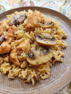 a plate with rice and mushrooms on it