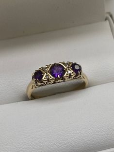 9carat yellow gold amethyst and diamond ring  Ring size:M Price: £205.00 Purple Diamond Ring With Diamond Accents For Anniversary, Purple Diamond Ring With Accents For Anniversary, Classic Yellow Gold Amethyst Ring With Diamond Accents, Elegant Three Stone Amethyst Ring For Gift, Elegant Three Stone Amethyst Ring As Gift, Formal Purple Amethyst Ring With Rose Cut Diamonds, Vintage Gold Amethyst Ring With Diamond, Diamond Amethyst Ring In Yellow Gold For Anniversary, Purple Diamond Ring With Rose Cut Diamonds