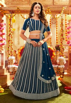 Navy blue faux georgette circular lehenga choli 120 Desc: Style : Circular Lehenga Choli Color : Navy Blue Fabric : Faux Georgette Work : Embroidery Sequence Wash Care : Dry clean Sleeve Style : Half Sleeve Long Sleeves : Done only in Custom Stitch Sleeves Lining : Done only in Custom Stitch Bust Size : 32 to 42 Inches Occasion : Wedding Festival Diwali Mehendi Sangeet Reception Ceremonial Baby Shower. With Express Free Shipping Buy Indian Party wedding wear Bridal Lehenga Choli Navy blue faux g Navy Blue Lehenga, Yellow Lehenga, Blue Lehenga, Lehenga Style, Ready To Wear Saree, Bridal Lehenga Choli, Navy Blue Fabric, Designer Lehenga Choli, Embroidered Wedding