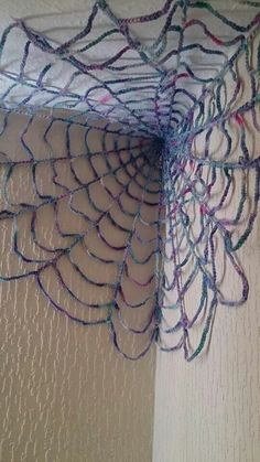 a close up of a net hanging on the wall