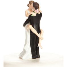 a figurine of a bride and groom holding each other in their arms on a white background