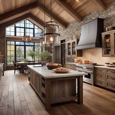 a large kitchen with wood floors and stone walls