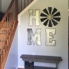 the farmhouse style decor is displayed on the wall