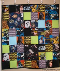 a star wars themed quilt hanging on the wall