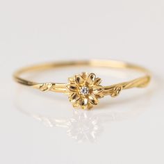 Birth Flower Gift Ideas, Dainty Promise Flower Ring With Birth Flower, Delicate Birth Flower Promise Ring, Dainty Flower Ring With Flower Charm, Yellow Gold Flower Promise Ring For May Birthstone, Fine Jewelry Flower Ring For May Birthstone, Heirloom Birth Flower Jewelry For Anniversary, Dainty Flower Ring With Birth Flower, Delicate Flower Birthstone Promise Ring