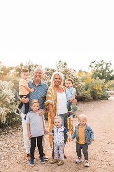 a family posing for a photo in the desert