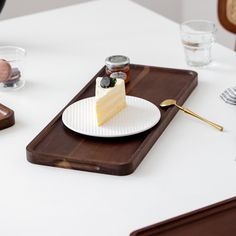 a piece of cake sitting on top of a white plate next to a knife and fork