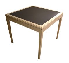 a wooden table with a black top on a white background