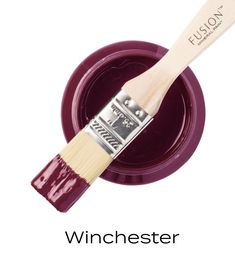 a close up of a paint brush with the words winchester on it