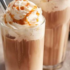 two drinks with whipped cream and caramel on top