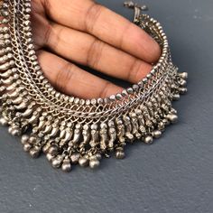 "Heavy ~ Wide Vintage ~ Art Deco Style ~ Ethnic ~ Hand crafted ~ silver choker Necklace from India (most likely Rajasthan ) ~ Front of necklace features a woven chain links with applied paisley motif which ends with hollow ball bead dangles ~Necklace ends with a chain and simple \"J\" hook and \"O\" ring at the end . Absolutely well made with fine details ~ It is possible that the necklace is made from an old anklet (not 100% sure though ) Unmarked acid tested positive for lower grade silver (be Beaded Dangle Necklace, Vintage Silver Necklace, Silver Cat Ring, Paisley Motif, Bead Dangles, Silver Choker Necklace, Woven Chain, Cat Ring, Dangle Necklaces