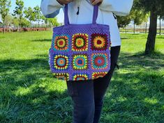 "This crochet granny square bag is hand crocheted with hight quality 100% cotton yarn. Its  size allows you to store what you need; phone, keys, glasses, wallet, notebook, books... It is fully lined inside with cotton linen fabric, with purple zipper and have two pocket inside. This multicolored green, orange,blue,red,burgundy,brown and yellow crochet pattern bag is perfect for your casual spring and summer outings. Measurements when flat; About 12,99 \" / 33 cm Wide About 10,23 \" / 26 cm High Daily Use Purple Crochet Bag, Rectangular Purple Crochet Bag, Rectangular Crochet Bag In Purple, Purple Crochet Tote Shoulder Bag, Vintage Rectangular Crochet Bag With Granny Square, Bohemian Purple Crochet Bag, Bohemian Crochet Bag In Purple, Handmade Bohemian Purple Crochet Bag, Purple Bohemian Crochet Bag For Daily Use