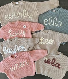 My current turnaround time for these hand embroidered sweaters is approximately 2 weeks.  These super cute hand embroidered name sweaters are perfect for your little ones! Sizes 0-6m to 4T. Sweaters are OVERSIZED and have a chunky fit. Refer to measurements below. Second photo of the name Sophie is with chunky dusty pink yarn for the letters. The flower is chunky natural with mustard center. If you would like a flower, order includes one flower free or charge for names without "i's." please include that you would like one. It will be located on the top left of sweater. 100% COTTON  For these sweaters below, 18-24m is the same as 2T. White Mocha Pink Dusty Blue Rose Pink Cream/Beige Lilac Measurements 0-3 months: length-11in./bust-12in./ sleeve-6in. 3-6 months: length-11.5in./bust-13in./sle Cute White Sweater With Embroidered Text, White Cute Sweater With Embroidered Text, Personalized Pink Long Sleeve Sweater, Cute Embroidered Winter Tops, Cute Winter Tops With Embroidered Text, Personalized Pink Sweater For Winter, Cute Sweater With Letter Embroidery For Fall, Cute Winter Sweater With Letter Embroidery, Cute Custom Embroidered Sweater For Winter