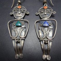 CIRCA 1950s SOUTH AMERICAN STERLING SILVER 925 EARRINGS INCAN FERTILITY DEITY DESCRIPTION:  These powerful earrings feature a fertility deity adorned with turquoise, lapis, and coral. Circa 1950s and acquired from the private collection of Federico Jimenez and Ellen Belber, these earrings will be a cherished addition to your collection of quality vintage South/Central American and Native American jewelry. Earrings measure 3 1/2" (including wires) x 1" WEIGHT: 16.8 grams SIGNED: no STERLING:  yes Antique Iberian Earrings, 925 Earrings, South Central, Central American, American Jewelry, South American, Native American Jewelry, Fertility, Silver 925