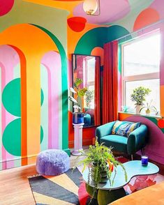 a living room with colorful walls and furniture