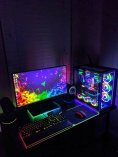 two computer monitors sitting next to each other in front of a keyboard and mouse on a desk