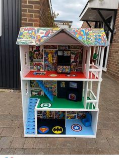 a toy house made to look like it is in the shape of a bookcase