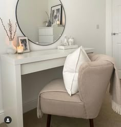 a white desk with a mirror and chair