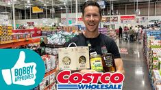 a man holding a package in a grocery store with the caption costco wholesale