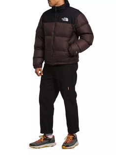 Built for mountain and city life, the 1996 Retro Nuptse jacket by The North Face has an unmistakable silhouette. With its water-repellent ripstop fabric and oversize down baffles for warmth, this jacket was made for the outdoors. It features a stow-away hood, Vislon© center front zipper, zipper slant pockets, elasticized cuffs, and a shockcord waistband for optimal comfort..Stow-away hood.Stand collar.Long sleeves.Zipper front.Concealed zipper slant pockets.Elasticized cuffs.Shockcord waistband. Functional The North Face Puffer Jacket With Pockets, The North Face Down Puffer Jacket For Outdoor, The North Face Nylon Puffer Jacket With Pockets, The North Face Puffer Jacket For Fall Outdoor Activities, Urban Puffer Jacket For Hiking In Fall, The North Face Streetwear Puffer Jacket With Detachable Hood, The North Face Puffer Jacket With Pockets For Outdoor, Urban Puffer Outerwear For Hiking, The North Face Down Puffer Jacket For Streetwear