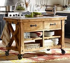 a kitchen island with plates and utensils on it in front of an oven