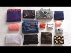 there are many different types of clothing on the bed and one is folded up to show it's contents