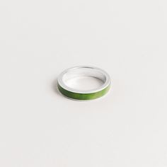 Introducing our exquisite 5mm Men's Inlay Band, crafted to perfection and designed to last a lifetime. This stunning ring features a beautiful inlay of green jade. Each piece of jade is carefully selected for its rich, vibrant color and unique patterns, ensuring that no two rings are alike. The classic width band is comfortable to wear and makes for a timeless addition to any collection. Our Men's Inlay Band is an heirloom-quality piece that is sure to become a cherished family heirloom. Crafted Two Rings, 14k Gold Ring, Green Jade, Family Heirloom, Jade Green, British Columbia, Band Ring, Unique Patterns, Band Rings