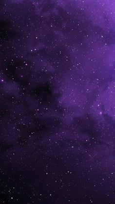 the night sky is filled with stars and purple hues, as well as dark clouds