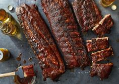 bbq ribs with beer and sauces on the side, ready to be eaten