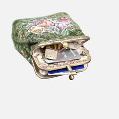 With a nod to the Victorian era, MCW’s freshly combines the classic and elegant design of the traditional carpet bag with a textural and tactile twist.The main body of coin purse is made with rich chenille carpet, cotton floral canvas, and brass clasp with double kiss lock.There are pockets for ID and cards on both side of middle panel, which makes this coin purse very functional and easy to organize your ID, cards, money and coins. This Victorian Carpet Coin Purse is going to be your daily comp Green Rectangular Bag With Coin Pocket, Vintage Green Clutch For Everyday Use, Vintage Green Coin Purse For Everyday Use, Vintage Pouch Bag With Card Slots, Vintage Green Rectangular Coin Purse, Elegant Green Coin Purse With Interior Card Slots, Elegant Green Coin Purse With Card Slots, Victorian Carpet, Traditional Carpet