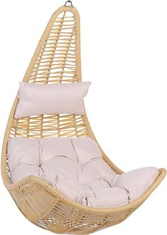 a hanging chair with pillows on the bottom and back cushions in beige color, it is made from wicker