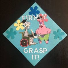 a blue graduation cap with an image of a cartoon character on it and the words, firmly grasp it