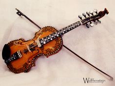 an old violin that is laying on the ground