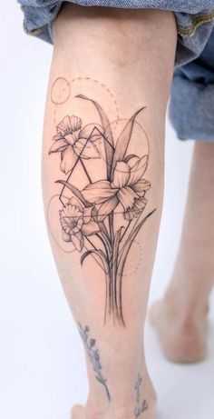 a woman's leg with flowers on it