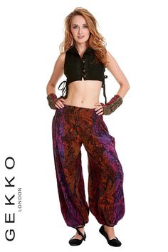 DESCRIPTION ASTRRS 12: Wide leg trousers with ankle pulls and rouched waist sides. Made of acrylic shawl fabric. Colourful, boho, harem, yoga, unisex trousers to keep warm and stylish for any occasion.  FEATURES: - Comfortable, it has laces to adjust at the bottom edge.  - Suited for any age.   - Animal cruelty-free, it is hand made from acrylic fabrics.   - Any piece is unique and rarely repeat.   - Ready to be shipped SIZES AVAILABLE: S/M and M/L. Please refer to the drawing in the pictures for all measurements about this style. DISCOUNTS ON MULTIPLE SHIPPING:  Additional items are always much cheaper - Etsy will show you the total shipping price before you make your purchase. COLOURS: This style comes in many different colours. Please contact us if you cannot find the colour you like am Bohemian Harem Trousers For Fall, Fall Bohemian Harem Pants, Bohemian Harem Pants For Fall Festival, Bohemian Multicolor Harem Pants For Fall, Multicolor Bohemian Harem Pants For Fall, Bohemian Multicolor Fall Harem Pants, Bohemian Harem Pants For Fall, Bohemian Fitted Winter Bottoms, Bohemian Fitted Harem Pants