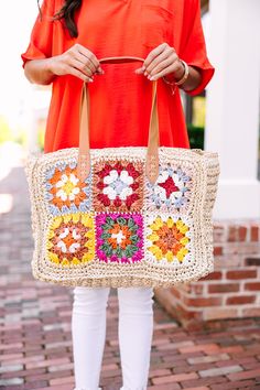 Turn heads with this stunning tote, featuring a captivating crocheted floral design that's sure to make a statement. Its unique craftsmanship offers a delightful blend of style and functionality, perfect for everything from beach outings to city shopping trips. White Square Crochet Bag For Vacation, Summer Cream Crochet Bag For Day Out, Beachy Natural Crochet Bag For Spring, White Square Crochet Bag For Beach, Bohemian Cream Crochet Bag For Vacation, White Square Crochet Beach Bag, Spring Bohemian Beige Crochet Bag, Spring Cream Crochet Straw Bag, White Bohemian Straw Bag For Spring