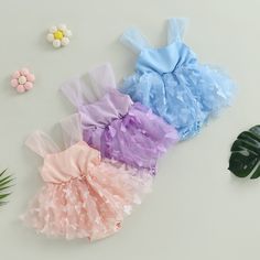 Add a magical touch to your newborn's wardrobe with this striking Butterfly Tulle Newborn Romper. Perfect for special occasions, the romper features a dazzling puffy tulle skirt dotted with enchanting butterflies. Give your little one a magical look and feel! Sleeveless design for maximum breathability Perfectly suited for the summer season, keeping your baby cool and stylish. Delightful floral prints add a touch of charm and cuteness. Crafted from a soft and durable blend of cotton and polyeste Playful Ruffled Tutu Dress In Tulle, Playful Ruffled Tutu Dress, Playful Ruffled Tulle Tutu Dress, Spring Tulle Tutu Dress With Bow, Spring Baptism Tutu Dress With Bow, Summer Tulle Tutu Dress With Bow, Summer Baptism Tutu Dress With Bow, Summer Tutu Dress With Bow For Baptism, Cute Tulle Tutu Dress With Bow