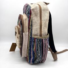 Introducing our handmade hemp backpack, a durable and eco-friendly option for carrying all your essentials. Crafted by skilled artisans, this backpack is made from high-quality hemp fiber and Heavy Duty Gheri Cotton fabric, known for its strength and durability. Not only is this backpack sturdy, but it also features a spacious interior with plenty of room for your laptop, books, and other daily necessities. The adjustable straps provide a comfortable fit, and the reinforced stitching ensures the backpack can withstand heavy use. But that's not all – our hemp backpack is also environmentally friendly. Hemp is a sustainable crop that requires minimal water and no pesticides, making it a popular choice for eco-conscious consumers. Plus, the backpack is handmade, so you can feel good knowing t Bohemian Beige Backpack, Bohemian Backpack In Natural Color For Everyday Use, Bohemian Style Natural Color Backpack For Everyday Use, Bohemian Natural Color Backpack, Bohemian Beige Rectangular Backpack, Eco-friendly Handmade Backpack, Hemp Backpack, Hemp Fiber, Day Backpacks