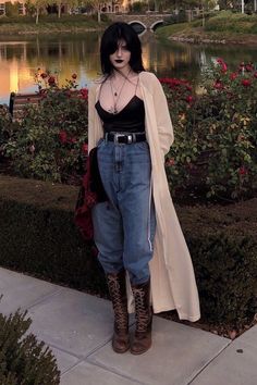 young woman in an edgy, alternative outfit is posing on a street Grunge Nonbinary Outfits, Alternative Baddie, Feminine Punk, Goth Cardigan, Edgy Capsule Wardrobe, Duster Cardigan Outfit, Street Goth, Goth Streetwear, Pinterest Trends