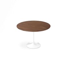 an oval wooden table with white base