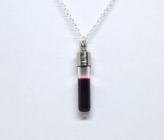 This amazingly beautiful gothic pendant is about 1.5 inches long and 0.25 inches wide.  It is filled with liquid fake blood and so will move realistically. It can also be filled with distilled water, left empty, or just contact me if you have something else in mind. The vial has a stainless steel cap and is hung on a sterling silver chain, your choice of length, and has a 2 inch extender chain finished off with a matching blood red 4mm Swarovski crystal. Please note that I do not include the extender chain for the 30 inch length necklace. I can also make earrings of this drop: https://etsy.me/30RdwPz Perfect for Halloween or every day! Vial Necklace, Gothic Pendant, Goth Halloween, Vampire Goth, Silver Necklace Pendant, Magical Jewelry, Dope Jewelry, Memento Mori, How To Make Earrings