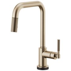 the kitchen faucet is shown in brushed brass