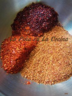 three different types of spices in a metal bowl