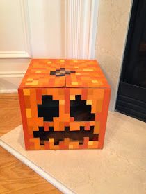 an orange box with a face made out of blocks